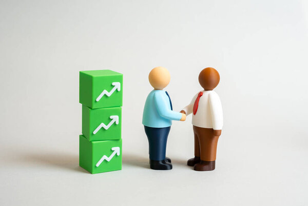 Бизнесмены заключают сделку, которая обещает прибыль. Концепция партнерства, переговоров, финансового успеха и инвестиционных возможностей. Символ доверия, амбиций и стратегического сотрудничества.