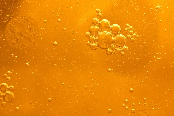 Yellow bubbles background, cooking oil emulsion, frying.