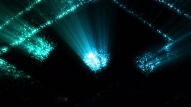 Siyah arka plandaki delikler ve kare şekiller arasında yanıp sönen renkli ışıklar.