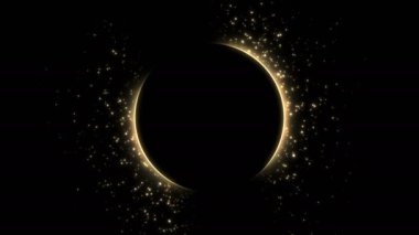 Parlayan parçacıklarla siyah zemin üzerinde altın çember 