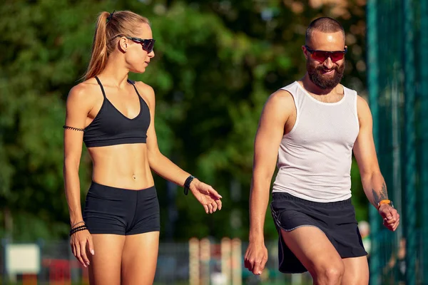 Woman and man doing jogging, diversity training of men and women together, healthy lifestyle, husband and wife training together