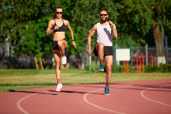 Woman and man doing jogging, diversity training of men and women together, healthy lifestyle, husband and wife training together
