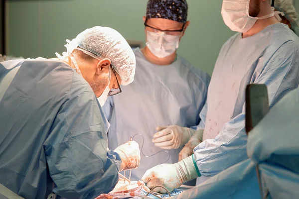 Shot Two Experienced Surgeons Alert Nurse Performing Operation Bright Electric — Stock Photo, Image