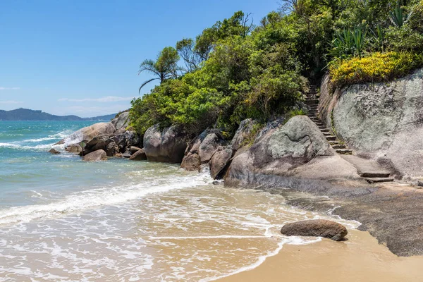 Stone stair in rocks and forest on the beach, Canto Grande de fora beach, Bombinhas, Santa Catarina, Brazil