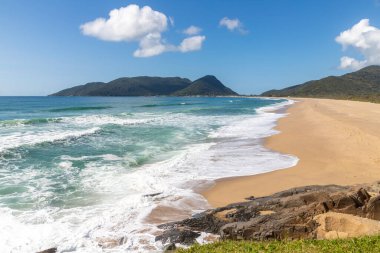 Mountains, Waves and sand at  Joaquina beach, Florianopolis, Santa Catarina, Brazil