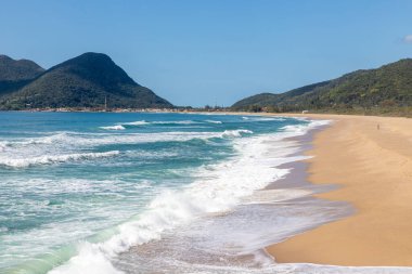 Mountains, Waves and sand at  Joaquina beach, Florianopolis, Santa Catarina, Brazil