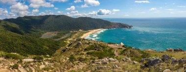 Panorama of Beach, forest and rocks in the wild Lagoinha do Leste beach, Florianopolis, Santa Catarina, Brazil