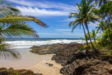 Sand, waves and rocks at Havaizinho beach, Itacare, Bahia, Brazil