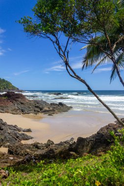 Sand, waves and rocks at Havaizinho beach, Itacare, Bahia, Brazil