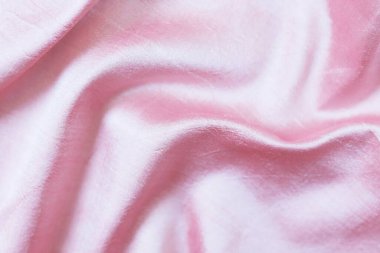 Texture of pink natural silk, folds, background for romantic congratulations, emotion of love