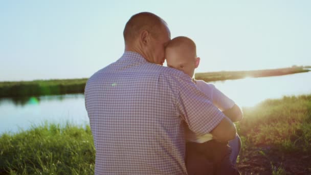 Caring Man Hugs Little Son Syndrome Showing Love Long River — Αρχείο Βίντεο