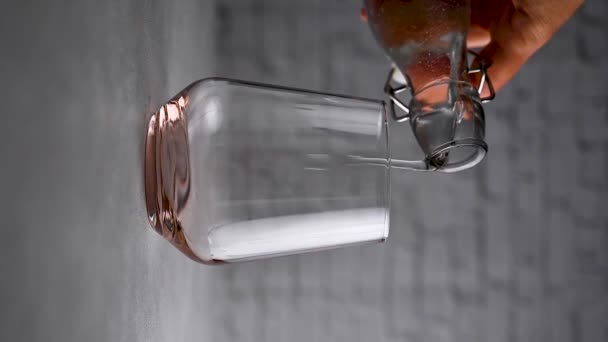 Pouring Clear Water Glass Sun Light Vertical Video High Quality — Stock Video