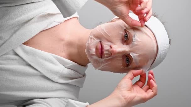 Woman Taking Textile Face Mask Skin Care Moisturising Cosmetic Procedure — Vídeos de Stock