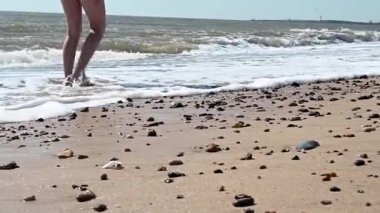 Barefoot walking on the beach, North Sea, England. High quality FullHD footage