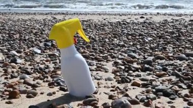 Sun cream bottle on the beach. Sun protection cream, uv rays. High quality FullHD footage