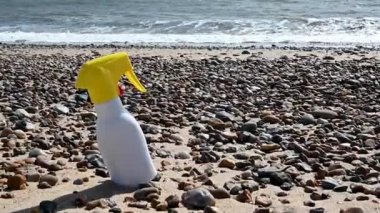 Sun cream bottle on the beach. Sun protection cream, uv rays. High quality FullHD footage