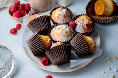 Homemade sweet muffins with fresh berries. Close up sweet treat.
