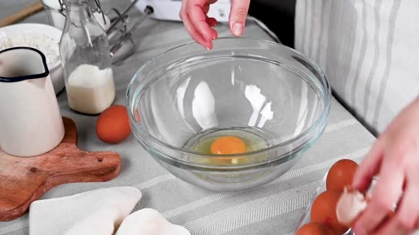 Breaking Eggs Glass Bowl Female Hands Cooking Dessert High Quality — Stockvideo