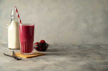 Berry smoothie milk shake drink with fresh fruits. Healthy eating copy space