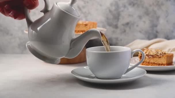 Pouring Hot Tea White Ceramic Cup Served Caramel Cheesecake High — Stock video