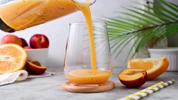 Pouring Fresh Orange Smoothie Peach Ginger Orange Blended Healthy Drink — Vídeo de Stock