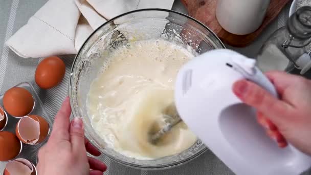 Mixing Eggs Sugar Top View Female Hands Using Hand Mixer — Vídeo de Stock