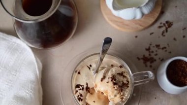 Affogato Italian dessert, coffee and ice cream in glass mug, top view