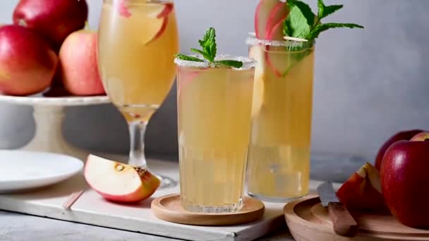 Three Cocktail Glasses Apple Cider Apple Juice Red Apples — Stock Video