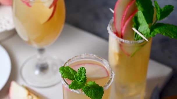 Three Cocktail Glasses Apple Cider Apple Juice Red Apples — Stock Video