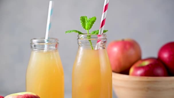Apple Juice Glass Bottles Fresh Red Apples Paper Straws — Stock Video