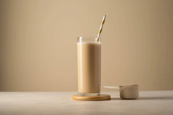 stock image Protein powder and drink in a glass. Copy space for text