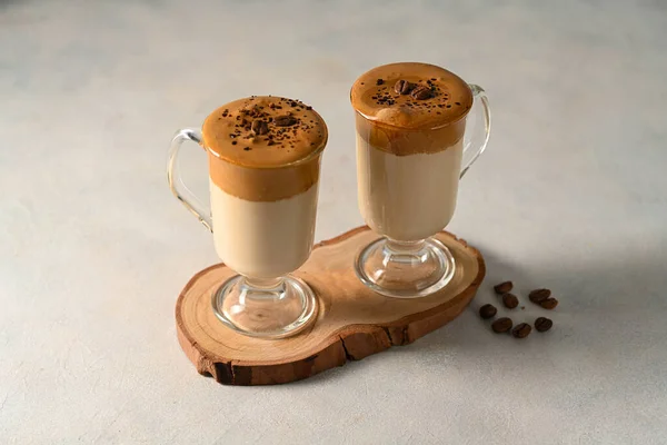 Dalgona coffee. Iced whipped coffee and milk. Refreshing coffee drink in glass cups