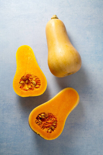 Butternut squash pumpkins on blue background.