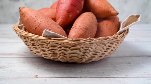 Whole Raw Sweet Potatoes Basket Bright Background Top View — Stock Video