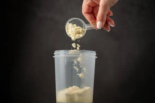 Vanilla white protein powder and shaker. Food supplement, nutrition