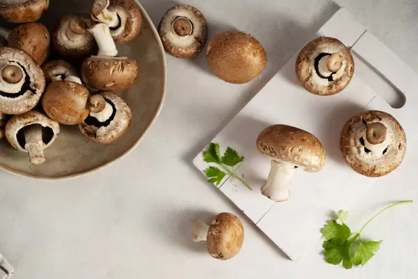 stock image Raw champignon on bright background, button mushrooms. Vegan protein