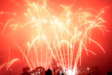 Colorful fireworks on foggy night sky, Corby, U.K., Bonfire celebration clipart