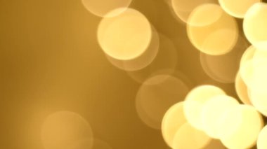 Noel soyut altın kahverengi bulanık bulanık bokeh ışık arkaplan, 4K video arkaplan.