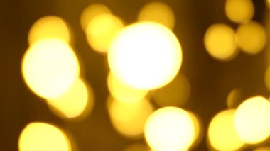 Noel soyut altın kahverengi bulanık bulanık bokeh ışık arkaplan, 4K video arkaplan.