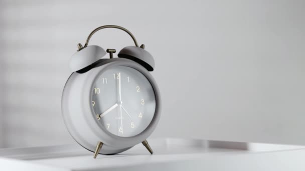 Minimalist Gray Alarm Clock Wooden Table Morning Light — Stock Video