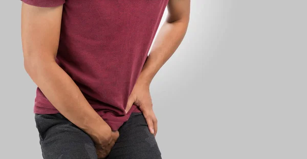 Man Having Groin Pain Gray Background Copy Space Right — Stock Photo, Image
