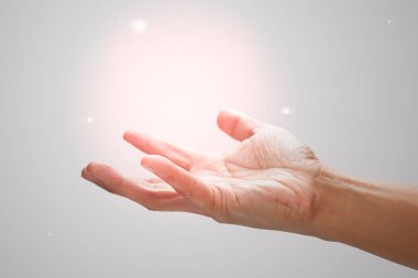 Male hand to hold something on a gray background.