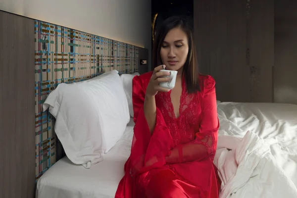 Woman Red Silk Nightgown Sitting Bed Drinking Hot Tea Night — Zdjęcie stockowe