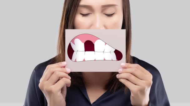 Asian Woman Blue Shirt Holding Brown Paper Broken Tooth Cartoon — Stock Video
