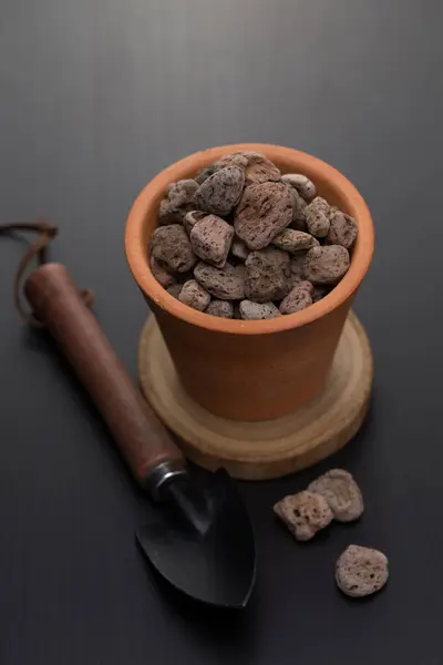 A Grey pumice or planting material for plant in a clay pots for plant propagation.