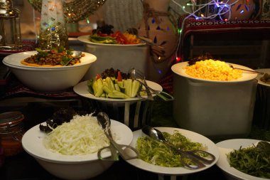 A captivating array of vibrant salads and fragrant rice options elegantly displayed at a 5-star hotel buffet in Muscat, Oman clipart