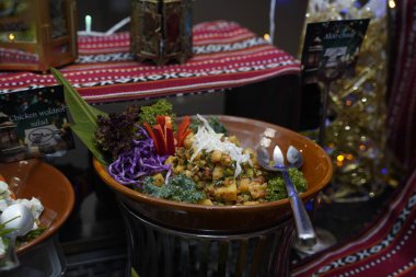 A stunning close-up shot of a colorful salad bowl, artfully arranged at a 5-star hotel buffet in Muscat, Oman, showcasing a festive atmosphere for Iftar. clipart