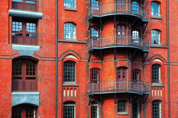 Red bricks house . German typical architecture . Residential house with balcony