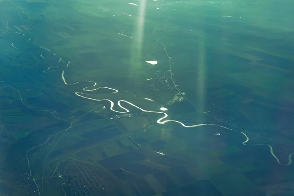 Flowing river view from airplane . Aerial Earth View