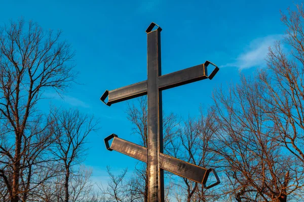Metal religious cross . Grave cross in the cemetery